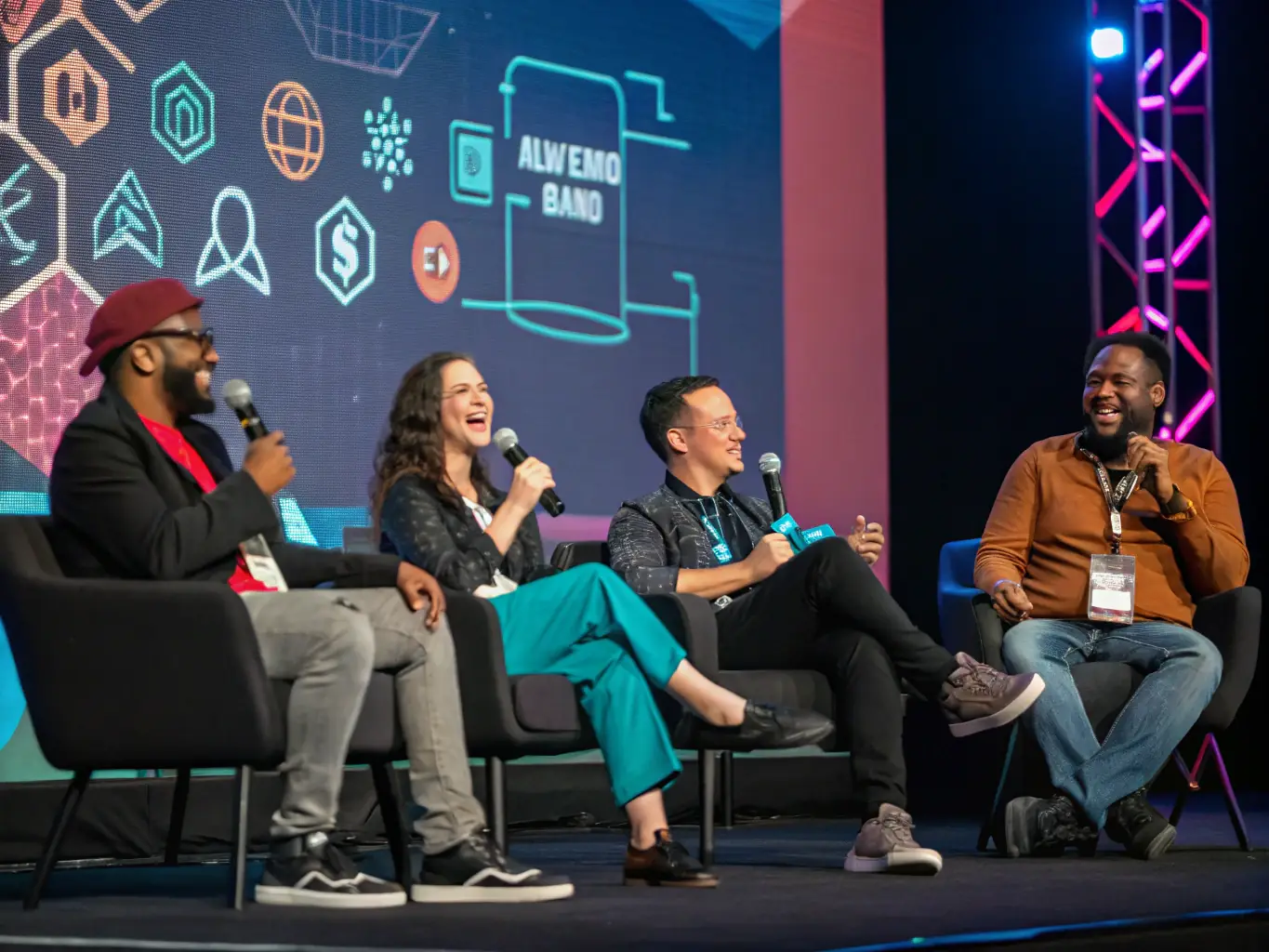 A photograph showing a panel discussion at the FutureTech Summit 2022, featuring industry leaders debating the future of blockchain technology.