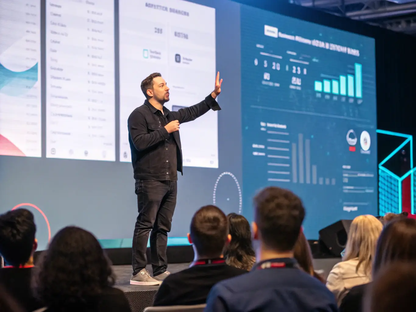 A photograph capturing a keynote speaker passionately presenting at the FutureGrid 2023 conference, with engaged attendees in the foreground.